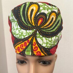A Mulitple Colored Red African Hat with matching Scarf with Tassels